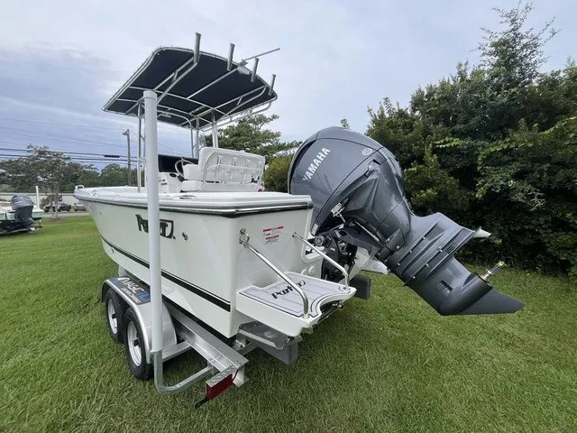 Slide: The Image of A 2027 Parker 210 Coastal boat on a trailer, featuring a Yamaha outboard motor. - 2
