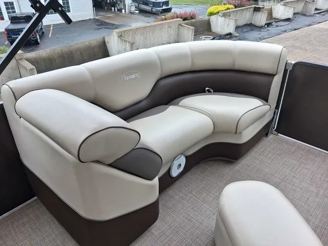 Slide: The Image of The image shows a beige and brown seating area on a boat. - 14