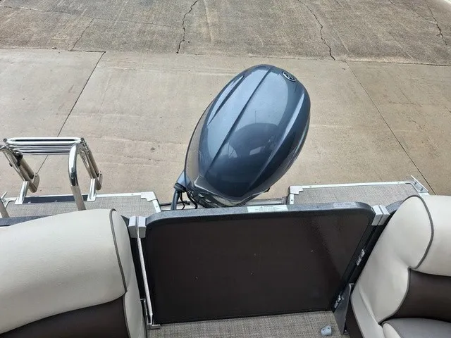 Slide: The Image of The image shows the stern of a 2015 Premier Sunsation RF 230 boat with an outboard motor. - 15