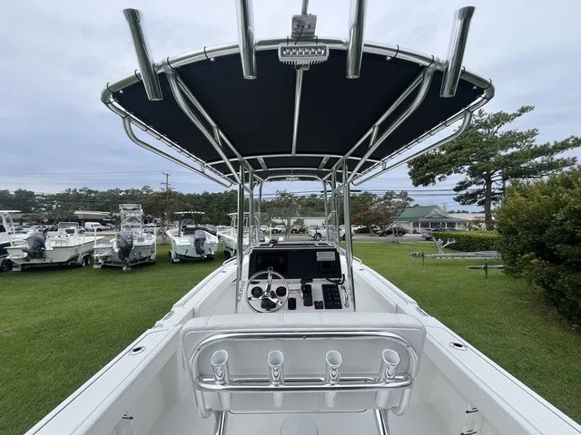 Slide: The Image of The image shows the cockpit of a Parker 210 Coastal boat with a black sunshade. - 11