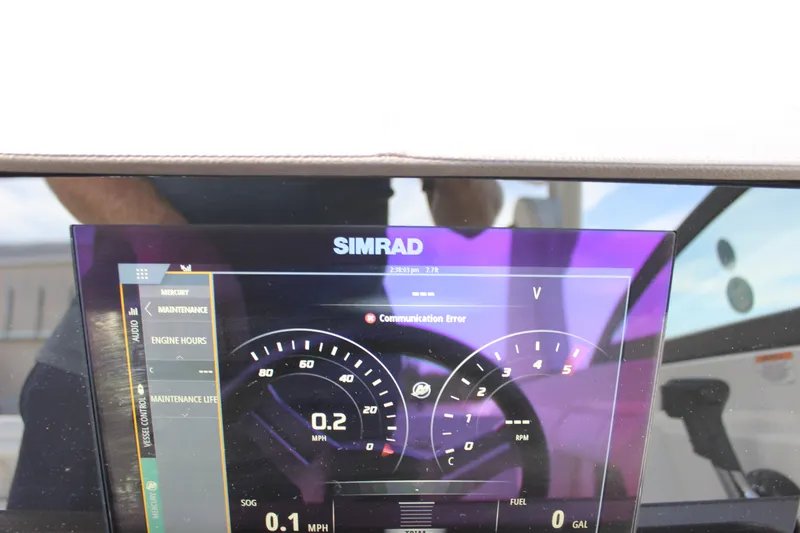 Slide: The Image of Simrad display on 2019 Sea Ray SDX 290 showing communication error and speedometer. - 50