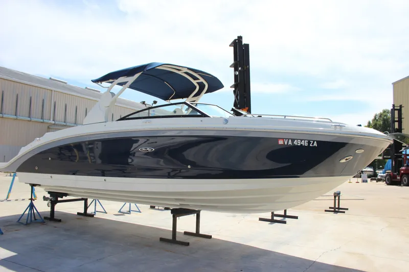 Slide: The Image of 2019 Sea Ray SDX 290 boat on display, featuring sleek design and blue hull. - 25