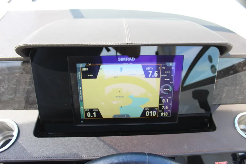 Slide: The Image of Simrad navigation display on 2019 Sea Ray SDX 290 boat dashboard. - 47