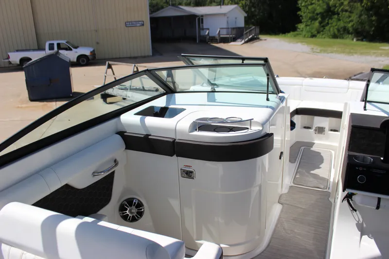 Slide: The Image of Interior view of a 2019 Sea Ray SDX 290 boat, featuring sleek seating and modern design. - 38