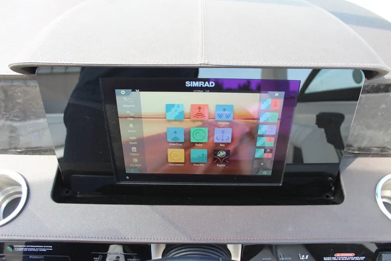 Slide: The Image of Simrad touchscreen display on 2019 Sea Ray SDX 290 boat dashboard. - 48