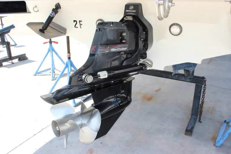 Slide: The Image of 2019 Sea Ray SDX 290 boat with MerCruiser engine and propeller on stand. - 14