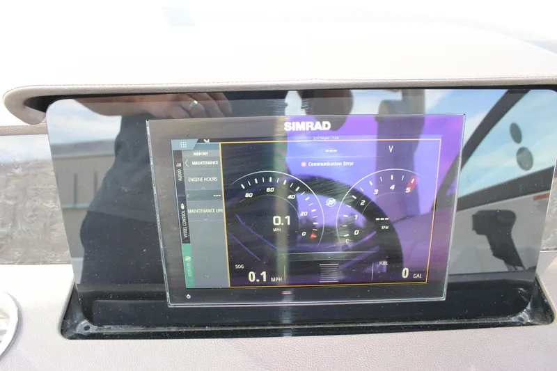 Slide: The Image of Simrad display on 2019 Sea Ray SDX 290 showing communication error and engine metrics. - 49