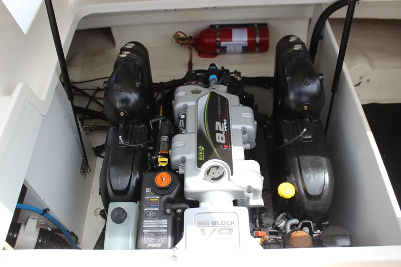 Slide: The Image of Engine compartment of 2019 Sea Ray SDX 290 boat with visible fire extinguisher. - 53