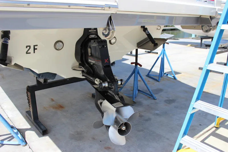 Slide: The Image of 2019 Sea Ray SDX 290 boat on stands, showcasing the MerCruiser engine and propeller. - 27