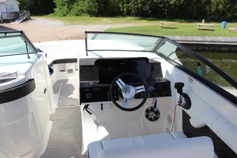 Slide: The Image of 2019 Sea Ray SDX 290 boat cockpit with steering wheel and control panel. - 39