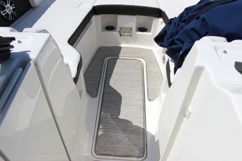 Slide: The Image of 2019 Sea Ray SDX 290 boat interior with seating and storage area. - 42