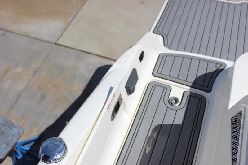 Slide: The Image of 2019 Sea Ray SDX 290 boat deck with sleek gray and white design. - 40