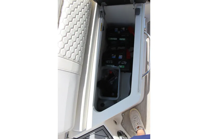 Slide: The Image of Storage compartment in 2019 Sea Ray SDX 290 boat with hexagonal seat pattern. - 45