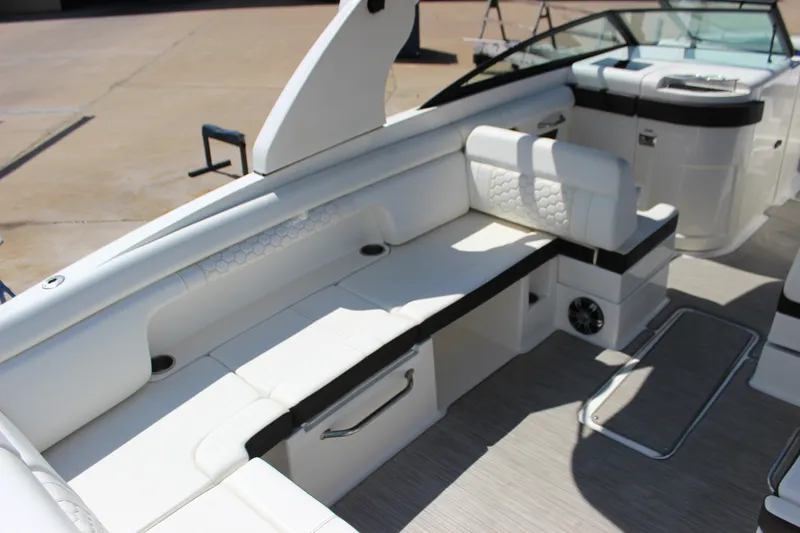 Slide: The Image of 2019 Sea Ray SDX 290 boat interior with white seating and modern design. - 35