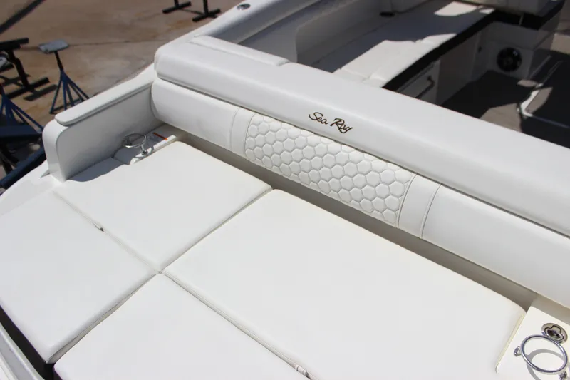 Slide: The Image of 2019 Sea Ray SDX 290 boat with luxurious white seating and elegant design. - 30