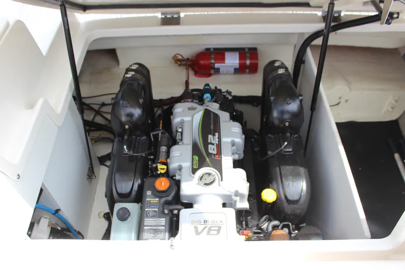 Slide: The Image of Engine compartment of 2019 Sea Ray SDX 290 boat with visible components and fire extinguisher. - 51