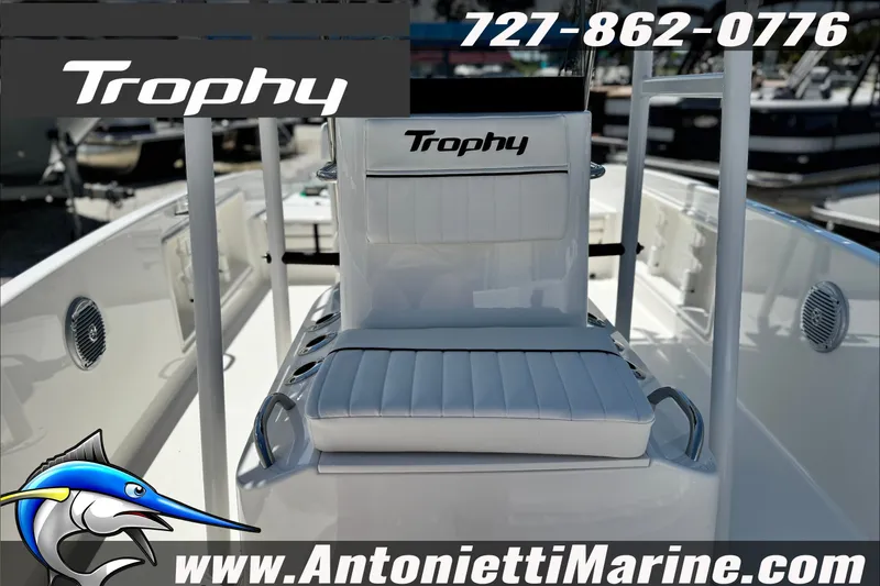 Slide: The Image of 2027 Bayliner Trophy T18 boat interior with seating, logo, and contact details for Antonietti Marine. - 10