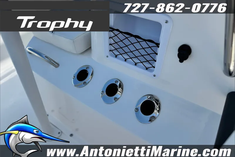 Slide: The Image of 2027 Bayliner Trophy T18 boat console with rod holders and storage net. - 19