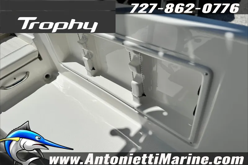 Slide: The Image of 2027 Bayliner Trophy T18 boat interior with contact details and logo. - 21