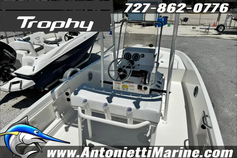 Slide: The Image of 2027 Bayliner Trophy T18 boat interior with steering console, displayed at Antonietti Marine. - 8