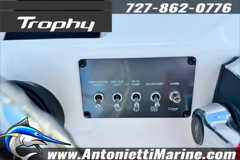 Slide: The Image of Control panel of 2027 Bayliner Trophy T18 boat with switches for various functions. - 18