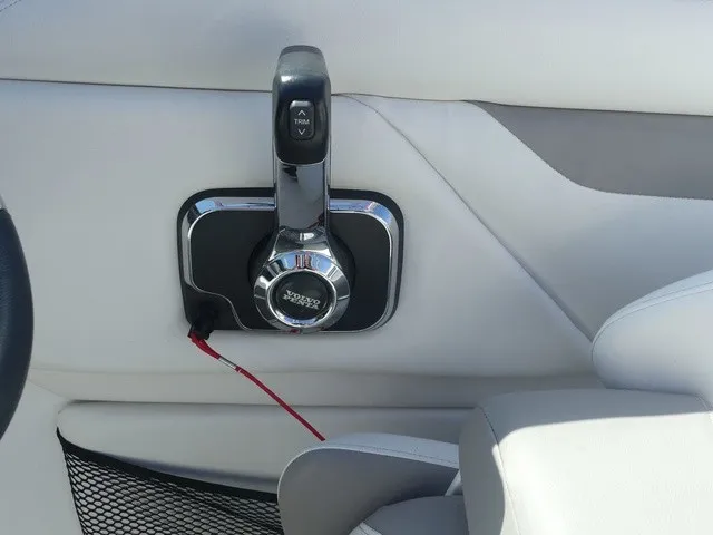 Slide: The Image of Close-up of a throttle lever in a boat, surrounded by white upholstery. - 15