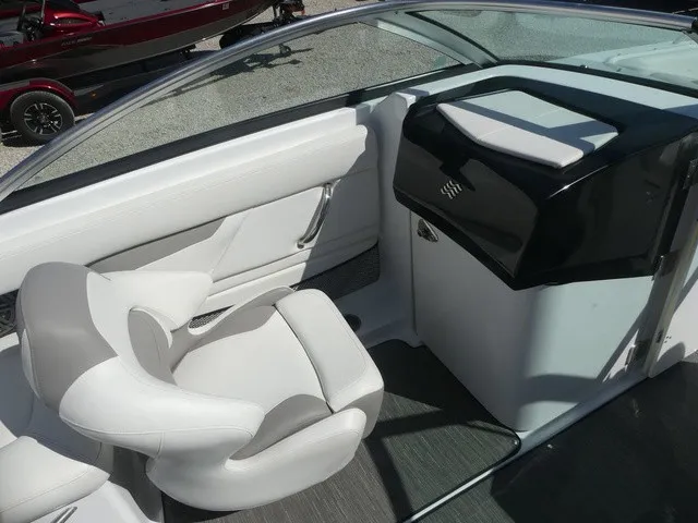Slide: The Image of The image shows the interior of a 2021 Four Winns HD3 Surf with white seating. - 16