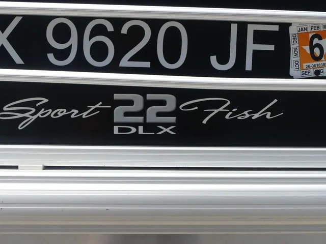 Slide: The Image of Close-up of the "SportFish 22 DLX" lettering on a boat. - 42