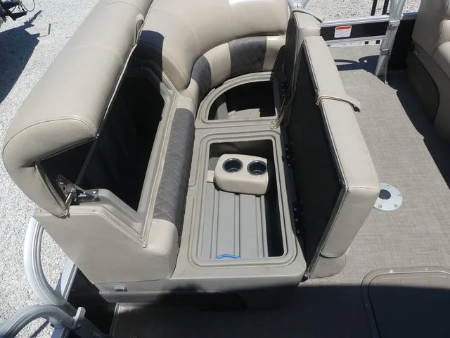 Slide: The Image of The image shows the beige upholstery and seating arrangement of a Sun Tracker SportFish 22 DLX pontoon boat. - 33