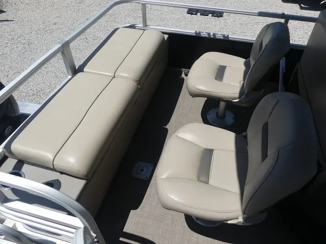 Slide: The Image of The image shows the interior of a 2020 Sun Tracker SportFish 22 DLX with beige seating. - 25