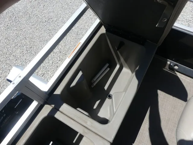 Slide: The Image of An open storage compartment on a 2020 Sun Tracker SportFish 22 DLX boat. - 26