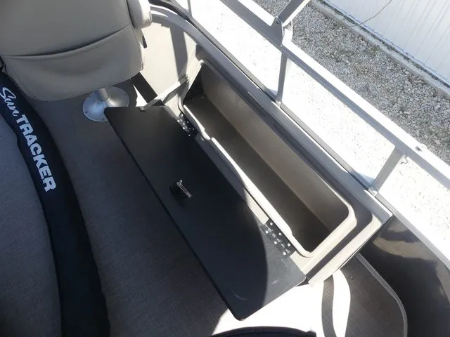 Slide: The Image of An open storage compartment on a 2020 Sun Tracker SportFish 22 DLX boat. - 28