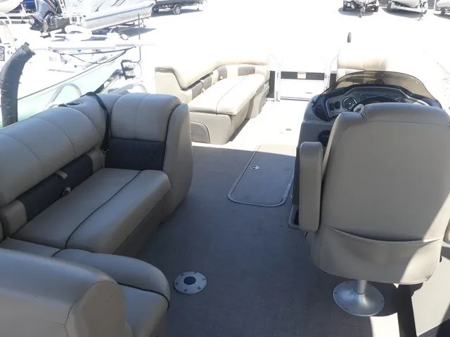 Slide: The Image of The image shows the interior of a 2020 Sun Tracker SportFish 22 DLX with beige seating. - 19