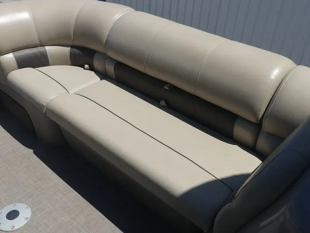 Slide: The Image of Beige upholstered seating on a boat with gray flooring. - 23