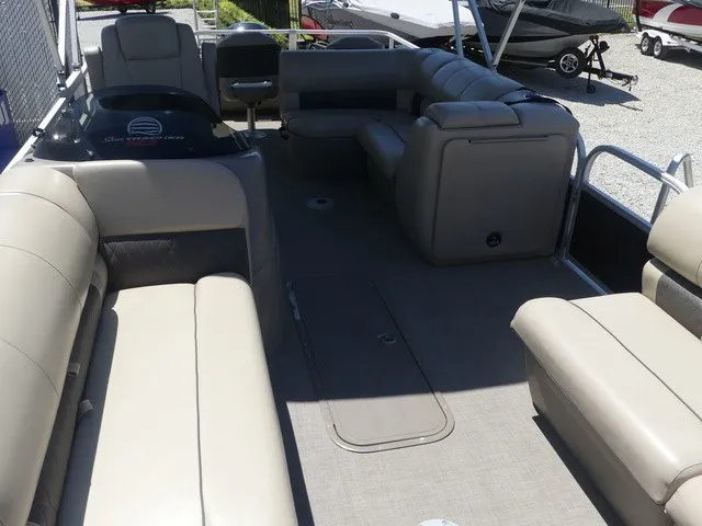 Slide: The Image of The image shows the spacious deck of a Sun Tracker SportFish 22 DLX pontoon boat with comfortable seating. - 21