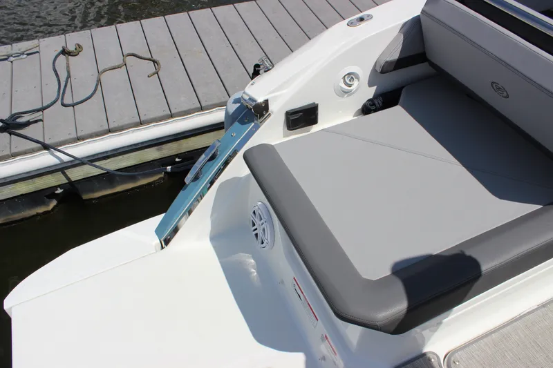 Slide: The Image of 2024 Cobalt R6 Outboard boat with sleek seating and dockside view. - 31