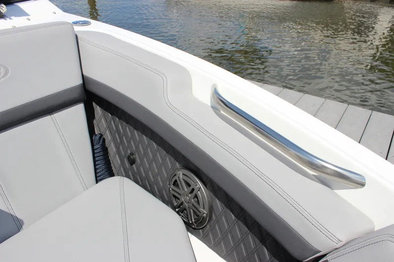 Slide: The Image of 2024 Cobalt R6 Outboard boat interior with sleek seating and stainless steel handle. - 21