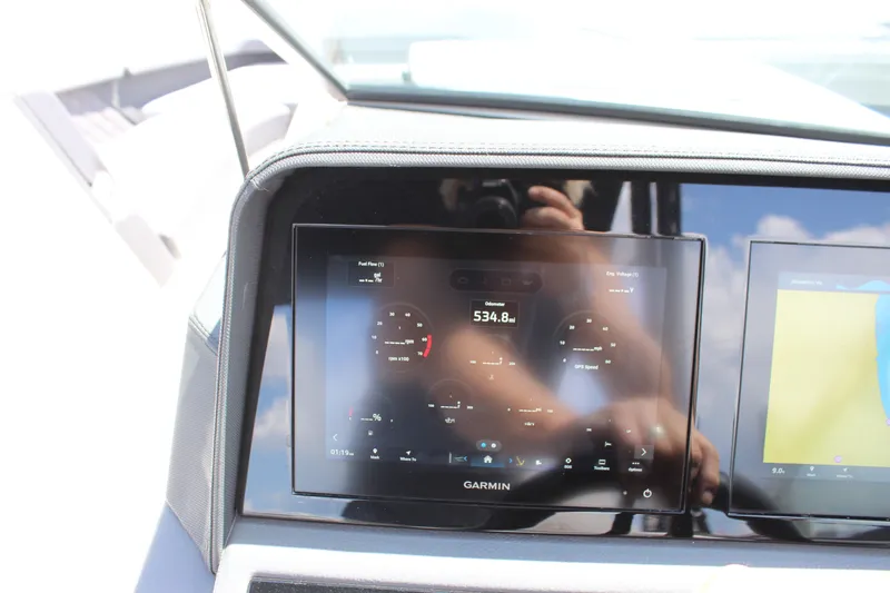 Slide: The Image of Dashboard of 2024 Cobalt R6 Outboard boat featuring Garmin display technology. - 41