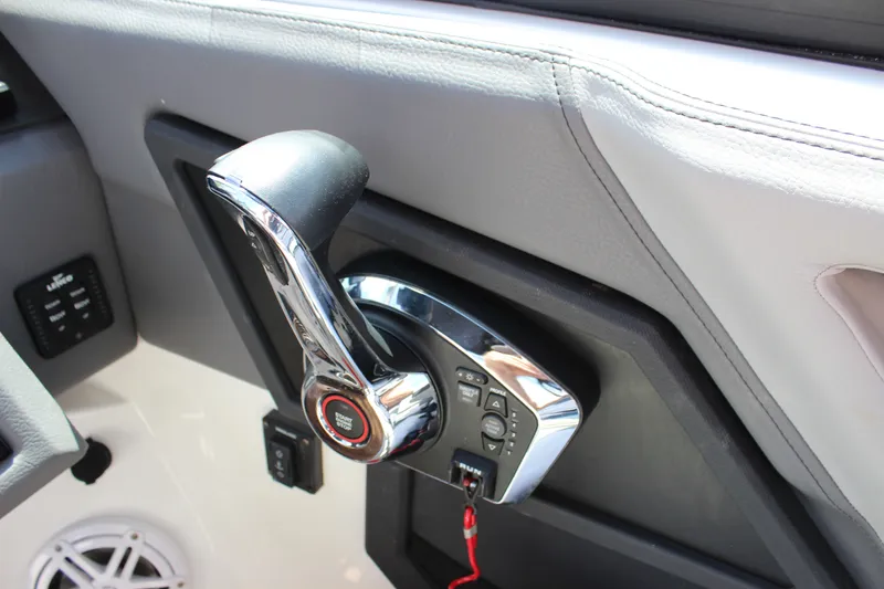 Slide: The Image of 2024 Cobalt R6 Outboard throttle control, featuring sleek chrome design and ergonomic handle. - 26