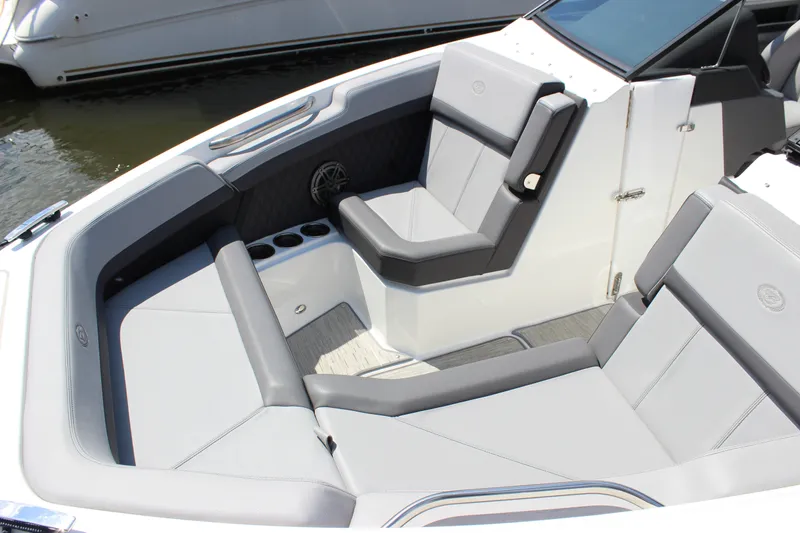 Slide: The Image of 2024 Cobalt R6 Outboard boat interior with luxurious gray seating and cup holders. - 7