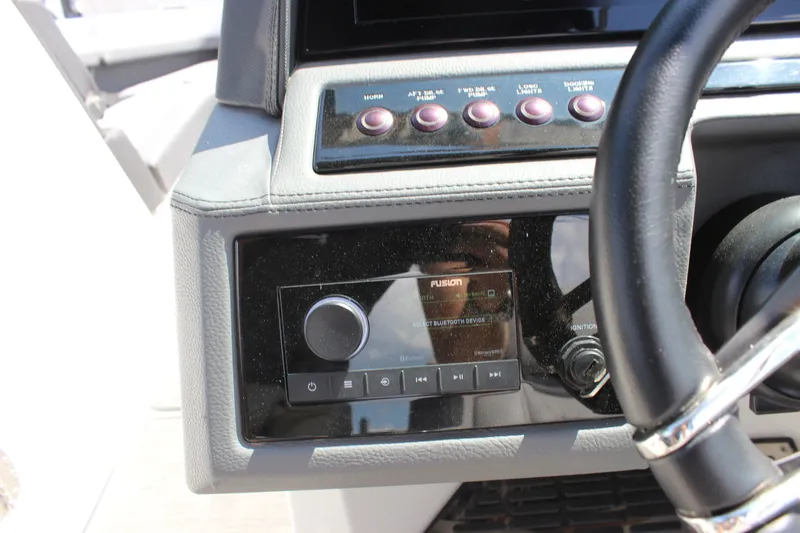 Slide: The Image of Dashboard of 2024 Cobalt R6 Outboard boat with Fusion audio system and controls. - 44