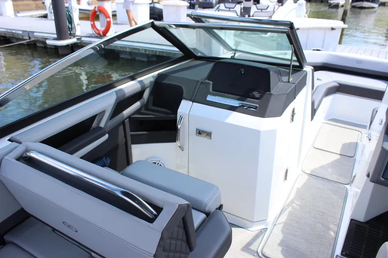 Slide: The Image of 2024 Cobalt R6 Outboard boat interior with sleek seating and modern dashboard design. - 14