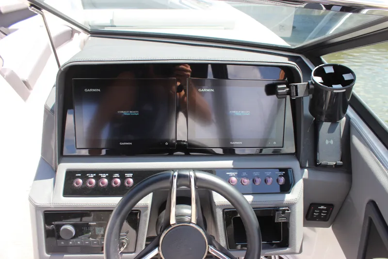 Slide: The Image of 2024 Cobalt R6 Outboard dashboard with dual Garmin displays and control panel. - 40
