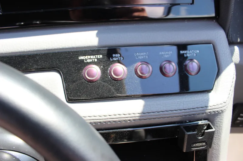 Slide: The Image of Control panel of 2024 Cobalt R6 Outboard with light switches for various functions. - 30