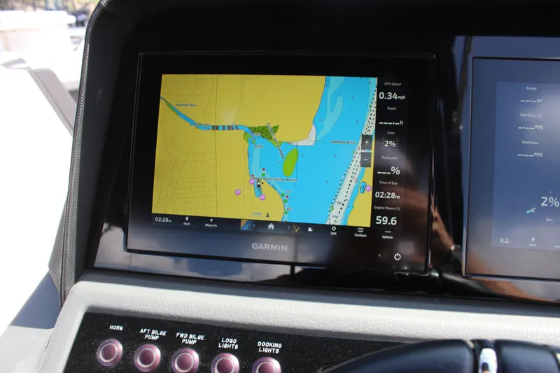 Slide: The Image of Garmin navigation display on 2024 Cobalt R6 Outboard boat dashboard. - 46