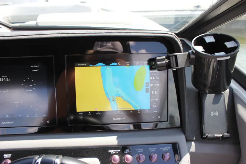 Slide: The Image of 2024 Cobalt R6 Outboard dashboard with Garmin navigation display and cup holder. - 42