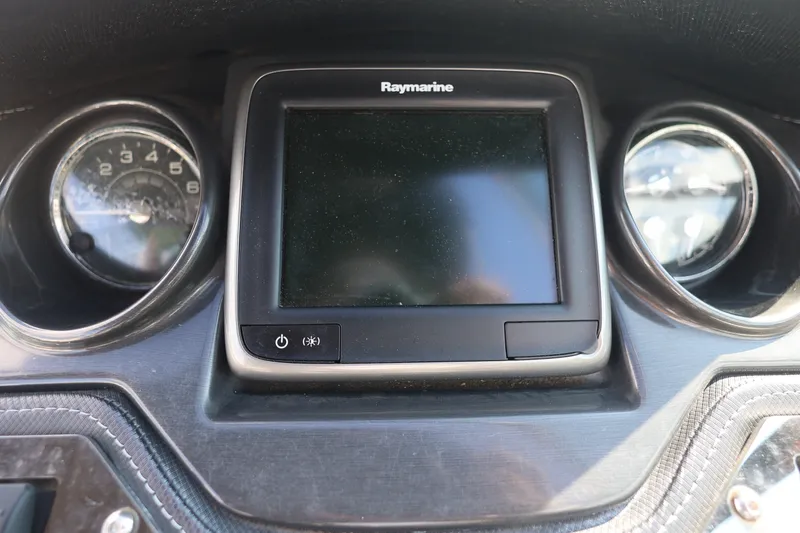 Slide: The Image of Dashboard of a 2014 Monterey 268SS Super Sport boat with Raymarine display. - 26
