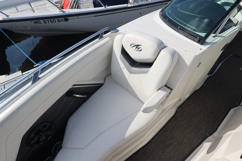 Slide: The Image of The image shows the white seating area of a 2014 Monterey 268SS Super Sport. - 34