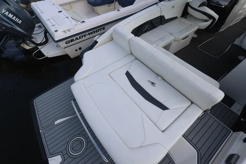 Slide: The Image of The image shows the stern of a 2014 Monterey 268SS Super Sport with a large padded sunbed. - 8