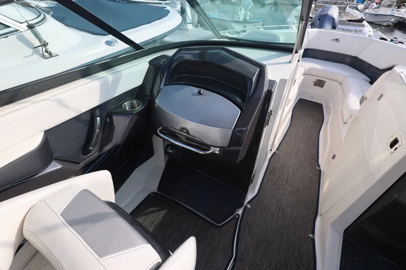 Slide: The Image of Interior of a 2014 Monterey 268SS Super Sport boat, featuring seating and helm area. - 30